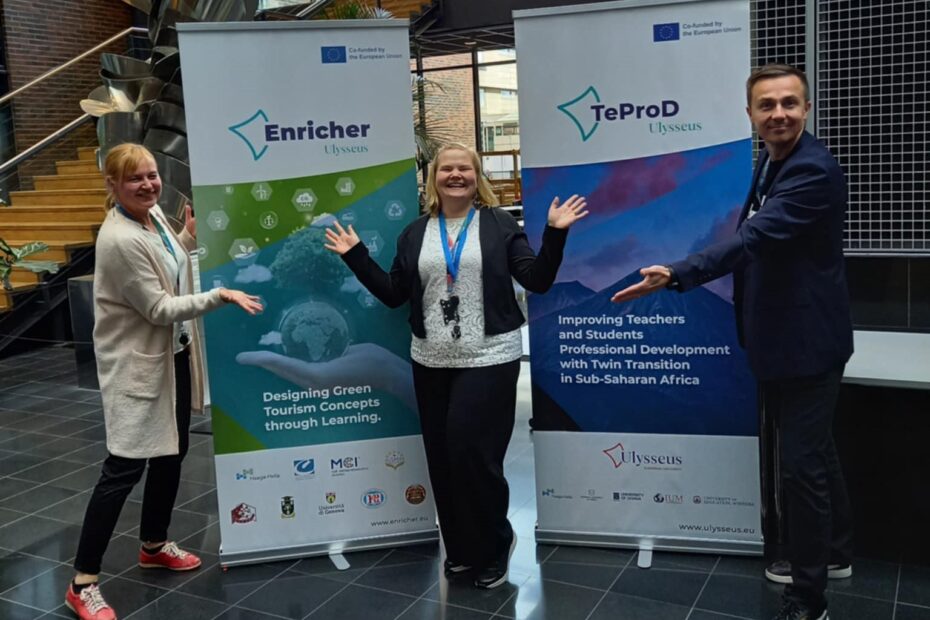 Speakers in front of the project roll-ups after the session.